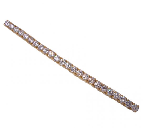 This elegant Four Prong Round Diamond Simulant Tennis Bracelet is a design classic that withstands the test of time.  Set in Sterling Silver with 14k yellow gold plating.