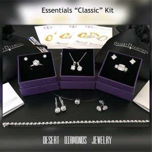 collection of several pieces of sparkling diamond jewelry on stunning black background