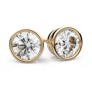 a pair of gold bezel set diamond stud earrings