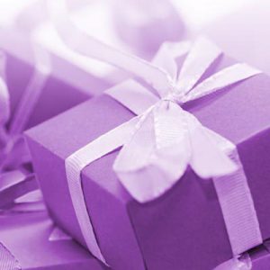 image of a soft purple gift box wrapped in a beautiful purple ribbon