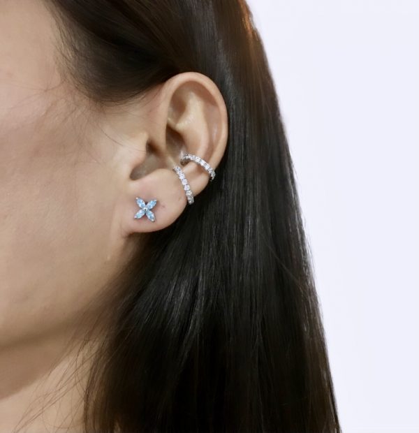 Small 4-petal flower stud earrings, designed as a cluster of four marquise-shaped aquamarine simulants, in sterling silver with white gold plating.