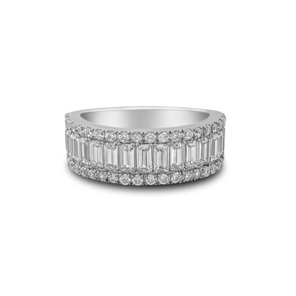 A sterling silver half eternity band with baguette and brilliant-cut stones, prong-set in a refined design with rhodium plating. Available with lab-created diamond simulants or blue sapphire simulant baguettes.